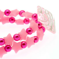 Pulseira elástica rosa com estrelas